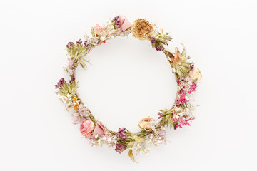 Minimal style photography. Dry flowers circle natural creative composition top view background with copy space for your text. Flat lay.