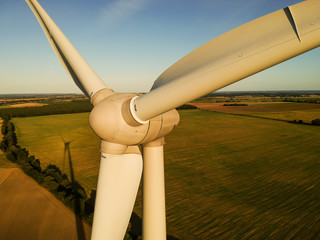 Wind turbine at sunset. Energy from wind.