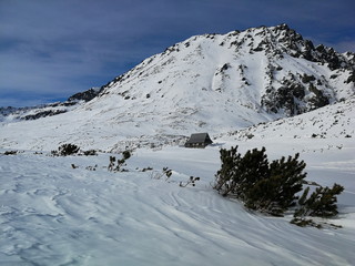 Fototapeta na wymiar Winter scenery in the Valley of Five Polish Ponds in the Tatra Mountains