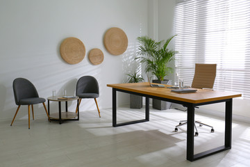 Director's office with large wooden table. Interior design