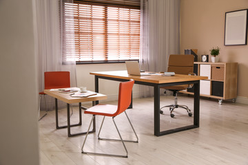 Director's office with large wooden table. Interior design