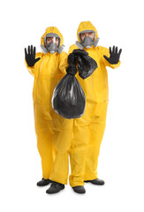 Man and woman in chemical protective suits with trash bag on white background. Virus research