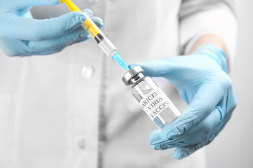 Doctor filling syringe with chickenpox vaccine, closeup. Varicella virus prevention