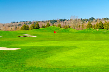 Obraz premium Golf place with gorgeous green and sand bunker.