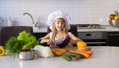  little girl, white chef hat, vegetables