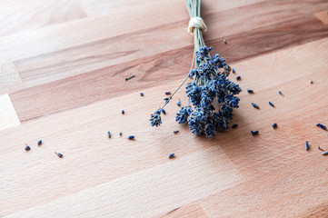 Dried lavender on rustic wooden table.