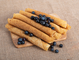 pancakes with berries and on a wooden Board