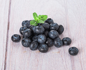 blueberries on a light wooden background