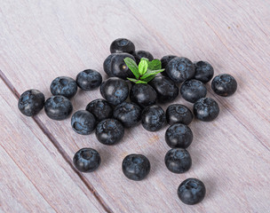 blueberries on a light wooden background