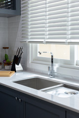 Sink silver with warm light in the kitchen