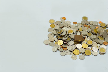 Coin money and lock, on gray background. Saving and financial security concept.