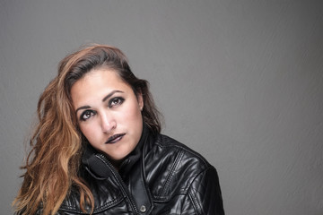 Portrait of beautiful woman in leather jacket.