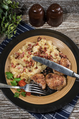 Mince chops served with boiled sauerkraut sprinkled with greaves.