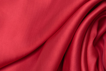 expensive fabric texture. abstract background with soft waves. Smooth elegant red silk or satin...