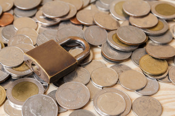 Coin money (Thai BAHT) and lock. Saving and financial security concept.finance, economy concept.