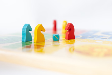 colorful gaming pieces, ludo board game concept, dice