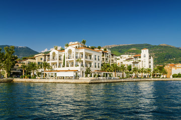 Fototapeta na wymiar Sunny view of luxury apartments at the port of Tivat, Montenegro.