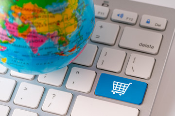 Online shopping icon with globe for global concept