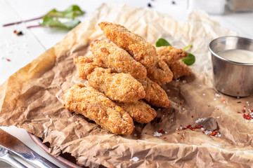 Chicken Nuggets Served on a Plate with White Sauce