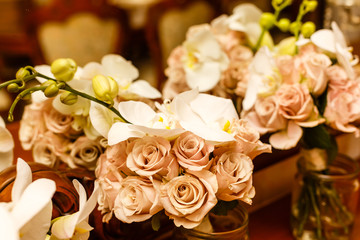 Bouquet of pale pink roses and white orchid, close up view