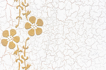 White venetian stucco with cracks and floral patterns. Liquid wallpaper.
