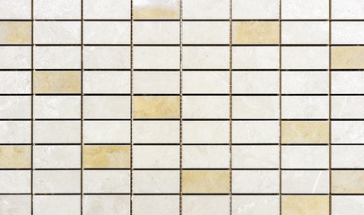 Ceramic mosaic tiles with beige and yellow rectangles.