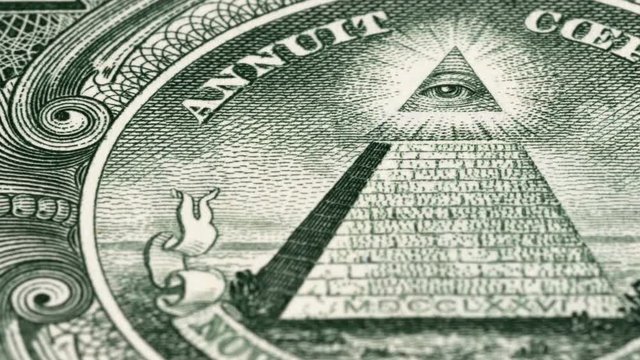 Great seal on 1 US dollar bill tracking, pyramid and Eye of Providence. Dolly shot. Low angle, macro. 4K