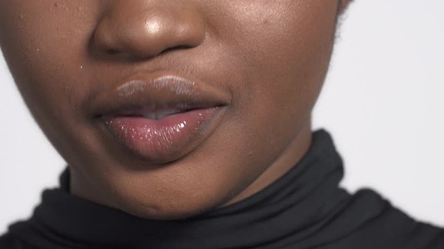 Smile of young African American woman. Big lips smile. Close-up