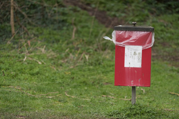 rural dog bin in park for pet waste