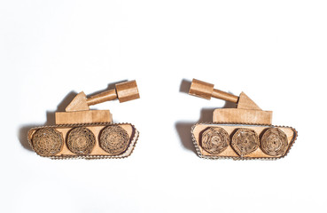 two toy tanks made by children from corrugated cardboard. toy cardboard tanks isolated on a white background