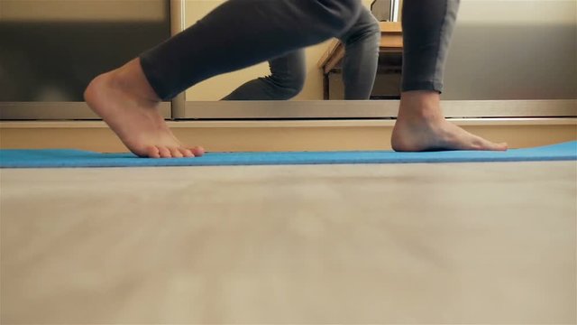 The man is doing gymnastic exercises. Slow motion.