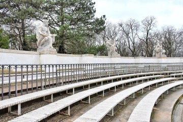 Warsaw, Poland - January 2020. The Amphitheatre at the Royal Lazienki park. White ancient ruins with the function of an open air theatre. Classical theater isle stage, amphitheater in Lazenki Royal 
