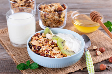Healthy breakfast. Muesli and yogurt with kiwi and banana. Healthy breakfast dieting concept