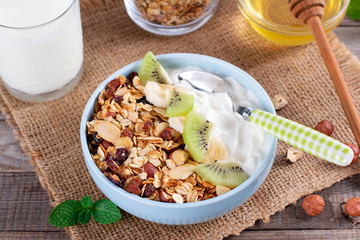 Healthy breakfast. Muesli and yogurt with kiwi and banana. Healthy breakfast dieting concept