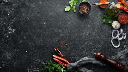 Black banner. Background of cooking, spices and vegetables. Top view. Free space for your text.