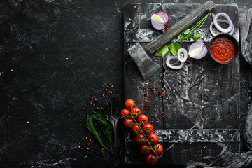 Black banner. Background of cooking, spices and vegetables. Top view. Free space for your text.