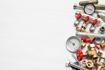 Plumbing flat lay concept background with copy space. Various water system accessories on white background.