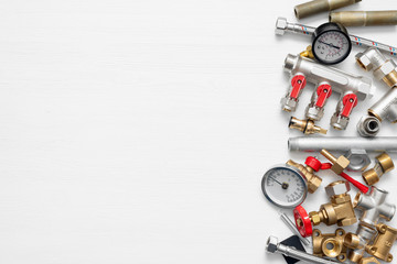 Plumbing flat lay concept background with copy space. Various water system accessories on white background.