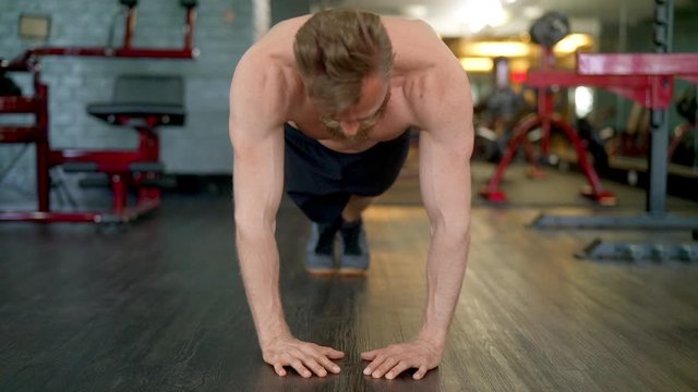 Handsome Male Athlete Doing a Full Diamond Push Up