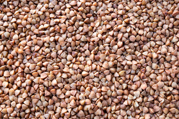 The background of buckwheat. View from above. Healthy eating and national kitchen concept.