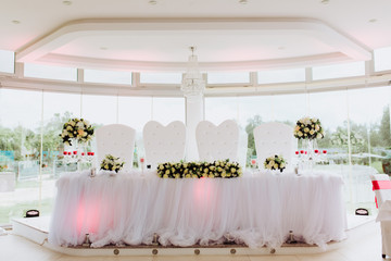 Coziness and style. Modern event design. Table setting at wedding reception.