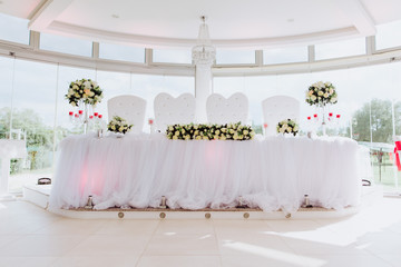 Coziness and style. Modern event design. Table setting at wedding reception.