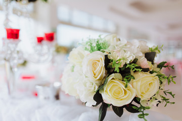 Coziness and style. Modern event design. Table setting at wedding reception.