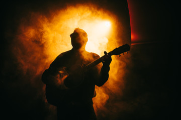 Guitarist guitar player on stage rock acoustic perform