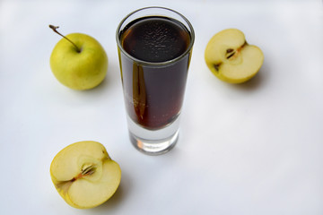 dark beer and apples on a white background