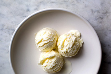 Three scoops of vanilla yogurt ice cream