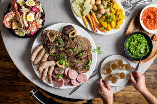 Bollito misto with vegetables, two dipping sauces and endive salad