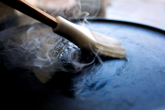 Close up view of basting a crepe pan