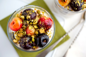 Yogurt parfaits with cherries and pistachios