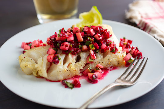 Selective focus of cod garnished with relish